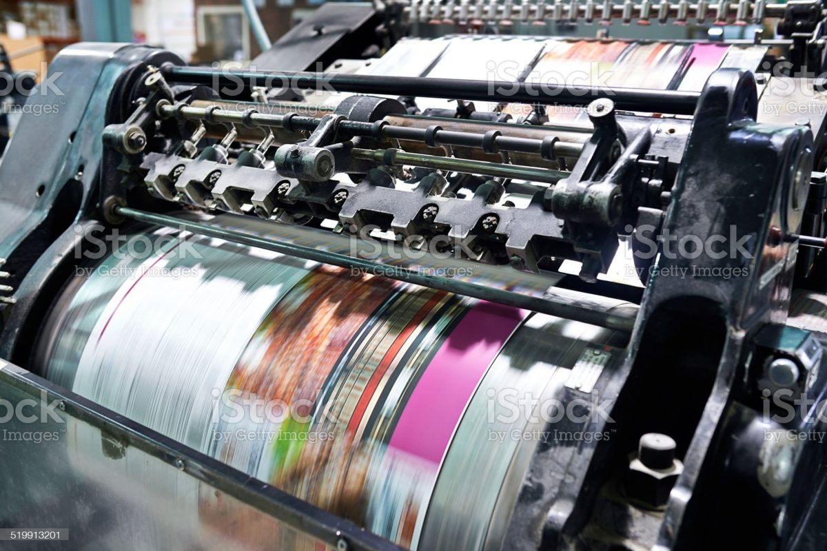 Detail shot of the workings of a printing factory. The commercial designs displayed in this image represent a simulation of a real product and have been changed or altered enough by our team of retouching and design specialists so that they are free of any copyright infringements